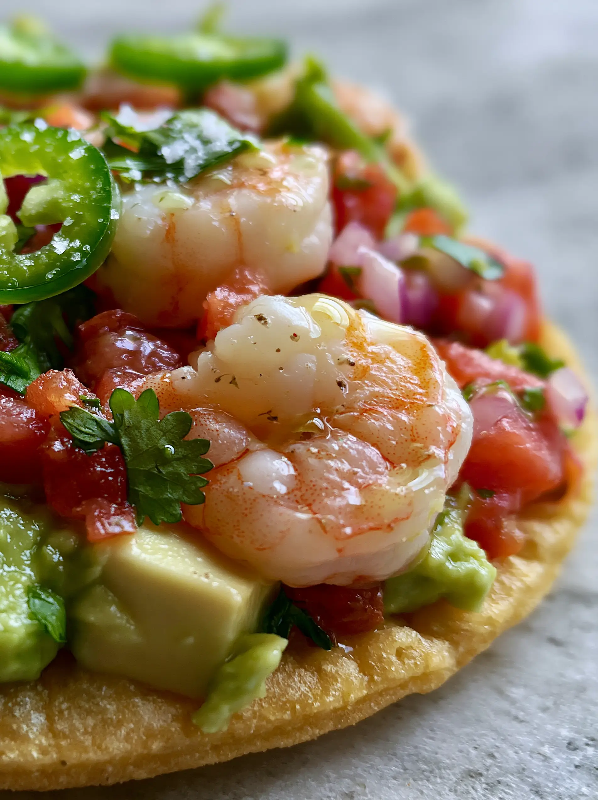 Extreme macro close-up of Mexican Shrimp Ceviche showing succulent pink shrimp, lime droplets, and sea salt flakes. (Mexican Shrimp Ceviche)